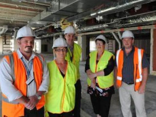 Southern District Health Board staff (from left) Warren Taylor, Linda Moir, Dr David Barker, Jan Seuseu, and Andy Sime at the site of the new children's ward and NICU. Photo by Gregor Richardson.