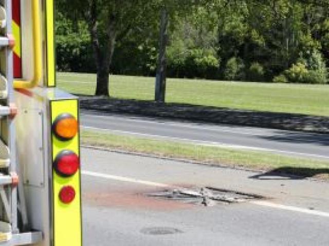 A Fulton Hogan worker photographs the manhole cover which was sent into the air by an explosion in Kaikorai Valley Rd yesterday. Photo by Craig Baxter. A Fulton Hogan worker photographs the manhole cover which was sent into the air by an explosion in Kaikorai Valley Rd yesterday. Photo by Craig Baxter.