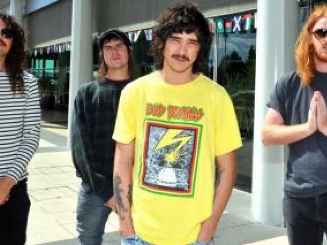 Sticky Fingers members (from left) Beaker Best, Paddy Cornwall, Dylan Frost and Seamus Coyle take in their first impression of Dunedin after arriving at Dunedin International Airport yesterday. Photo by Gregor Richardson.