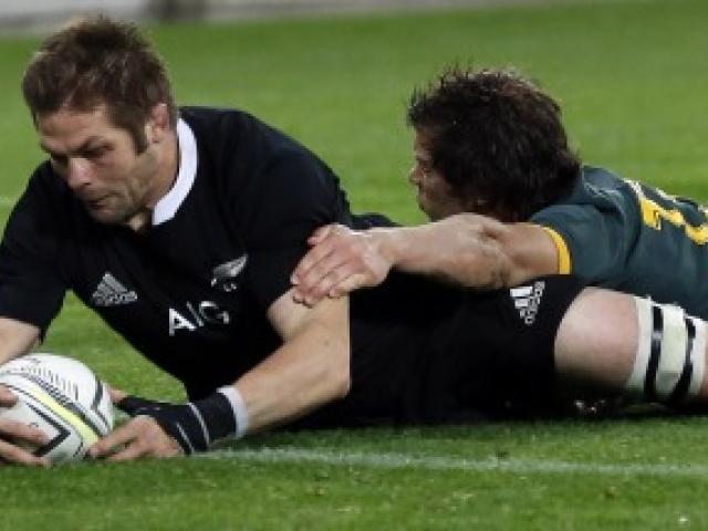 All Black captain Richie McCaw scores in the tackle of Springbok centre Jan Serfontein during their Rugby Championship match at Westpac Stadium in Wellington on Saturday night. Photo by Reuters.