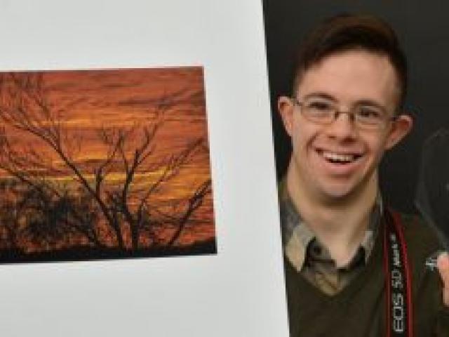 Carlos Biggemann displays his winning print and trophy from the international section of the My Perspective, United Kingdom Down Syndrome Association photography competition. Photo by Gerard O'Brien.