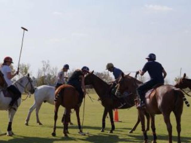 Queenstown reporter Tracey Roxburgh, second from left, was part of a group taught the fine art of polo in Buenos Aires last year. Photo by Puesto Viejo Estancia & Polo Club.