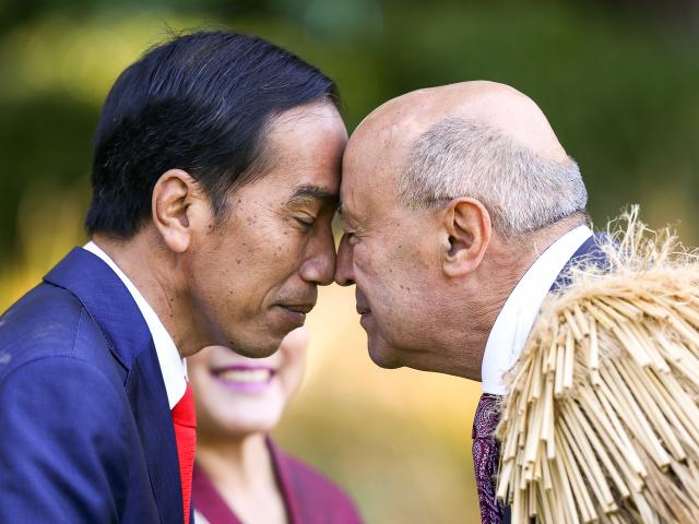 Joko Widodo is greeted with a hongi by kaumatua Professor Piri Sciascia. Photo: Getty Images 