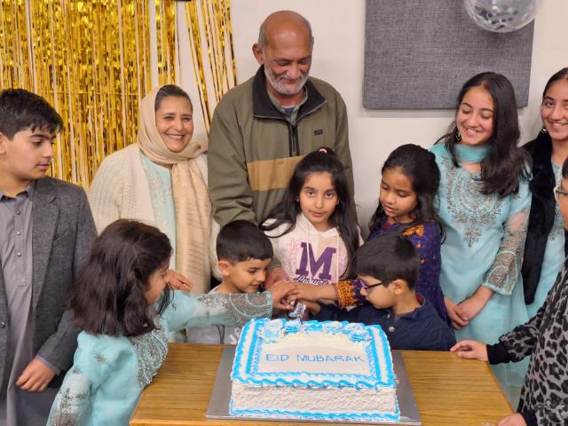 Eid Cake cutting by the senior most menbers of Dunedin Pakistan Society