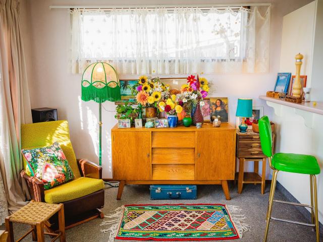 The green bar stool in Anna and Sean Easton’s home is one of three they bought for $2 at a tip...