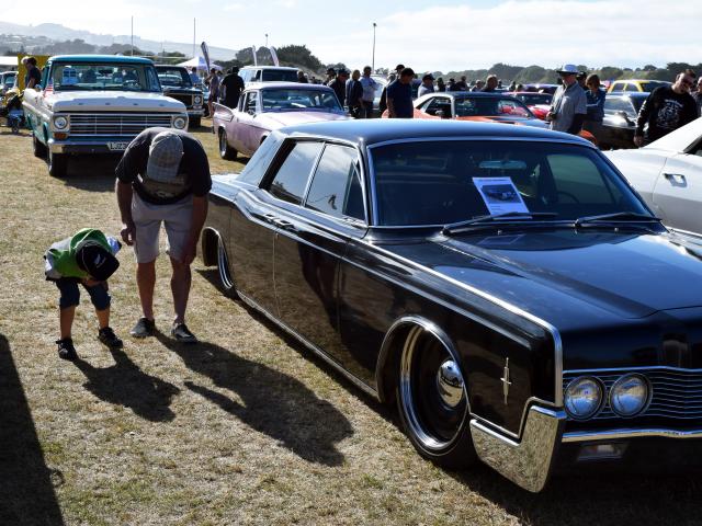 Intriguing . . . Blake Gaston (then 6), of Wingatui, gives his father the low-down on a 1966...