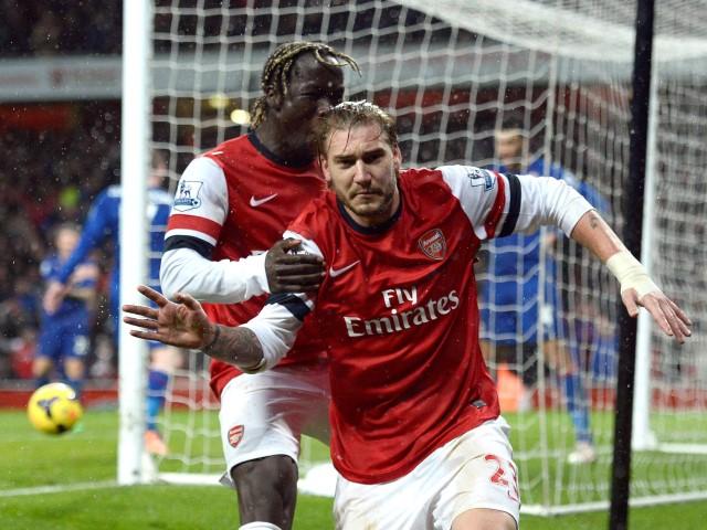 Arsenal's Nicklas Bendtner (R) celebrates his goal against Cardiff City with Bacary Sagna....
