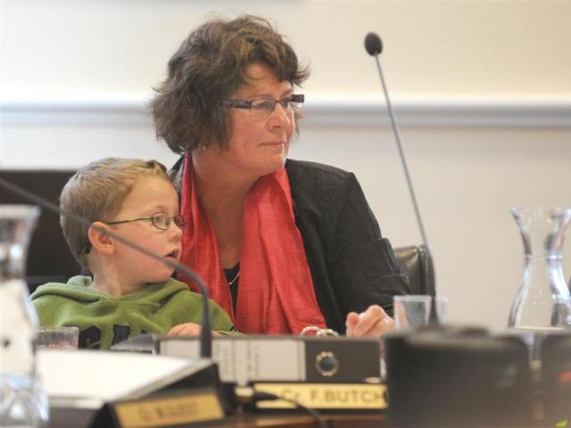 Cr Fliss Butcher and her grandson, Rafferty Jarman-Shirkey (3), listen to submissions at the...