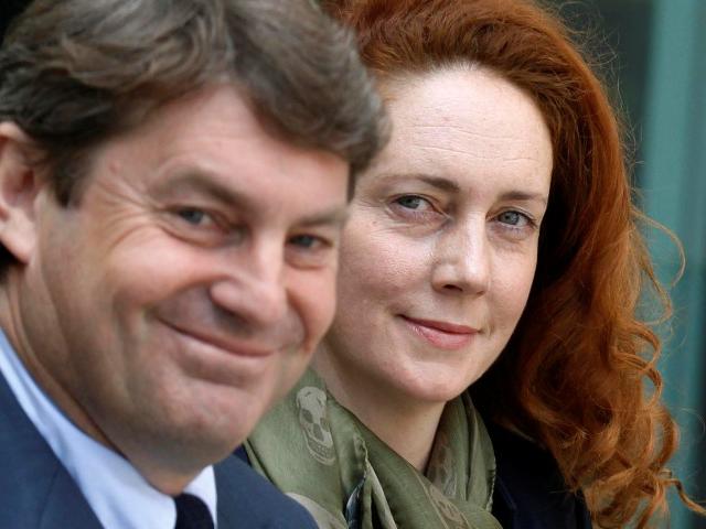 Former News International chief executive Rebekah Brooks and her husband Charlie Brooks leave...