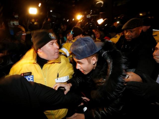 Justin Bieber arrives at a police station in Toronto where he was charged with assaulting a...