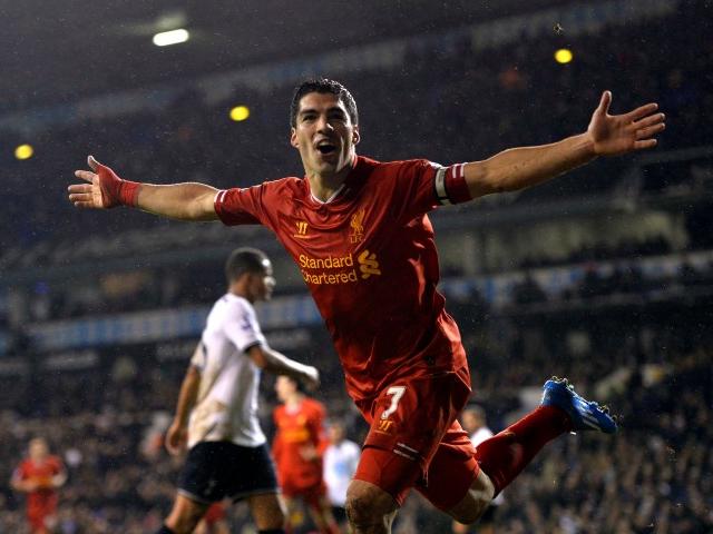 Luis Suarez celebrates after scoring against Tottenham Hotspur at White Hart Lane in London....