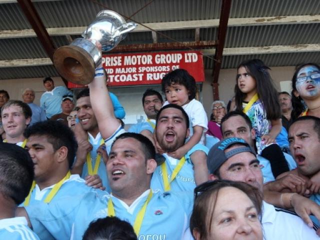 Members of the East Coast rugby team celebrate after winning the Meads Cup final between East...
