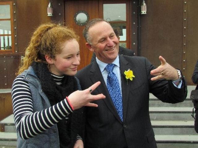 Nadia Kerr (16), of Oamaru, teaches Prime Minister John Key a ''Westside'' gesture. PHOTO: David...