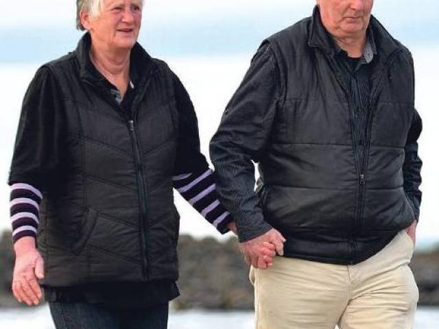 Pam and Paddy Paterson enjoy a walk on the beach at Kaka Point yesterday. Photo Peter McIntosh