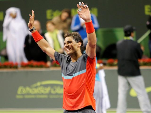 Rafael Nadal celebrates his victory in the Qatar Open final. REUTERS/Ahmed Jadallah