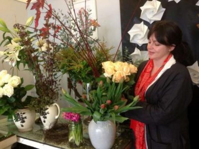 Jolene Wilkinson rearranges a display in her Moray Place boutique