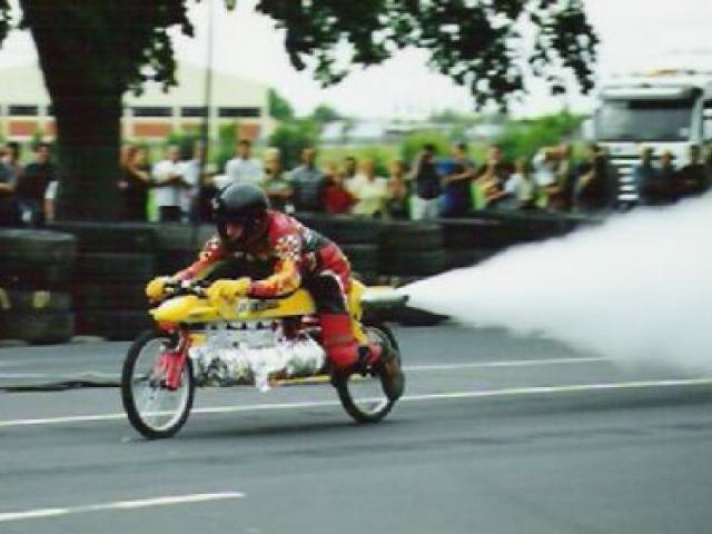 Mr Beck blasts his steam-powered rocket bike along Princes St, Dunedin. Photo: The Rocketman.com
