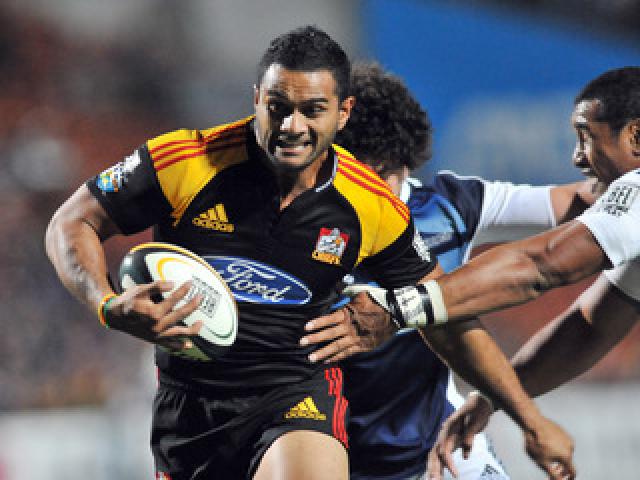 Chiefs Lelia Masaga slips pass Blues Jerome Kaino on his way to score