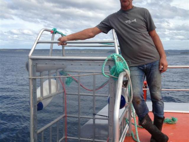 Shark Dive NZ director Peter Scott, of Dunedin, does not believe cage diving is encouraging...