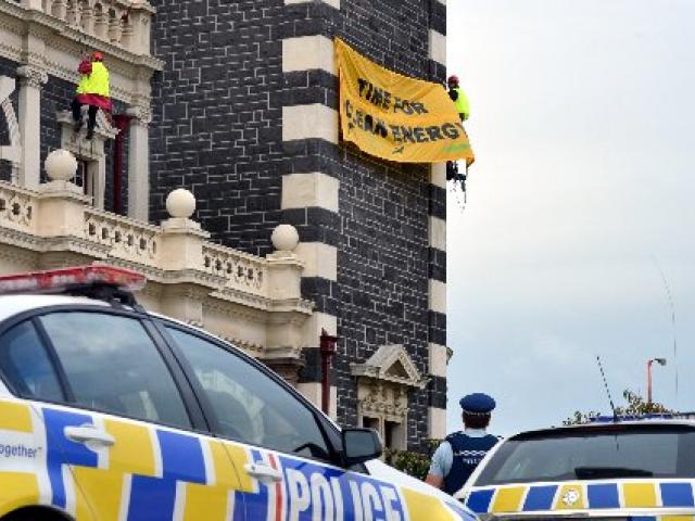 The protest banner three climbers unfurled  on behalf of  Greenpeace and Oil Free Otago on...