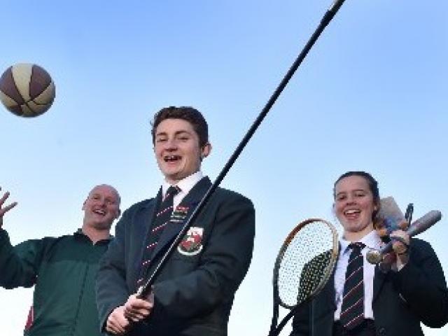 Head of sport Jeremy Scott and year 13 pupils Jesse Irvine (left) and Jess Chisholm (both 17)...