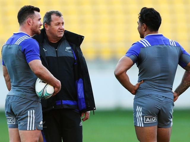 Ryan Crotty (L) and Malakai Fekitoa (R) talk with assistant coach Ian Foster. Photo: Getty Images