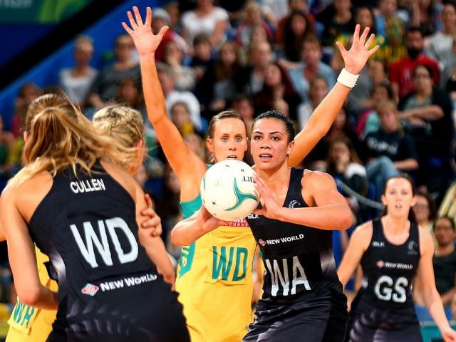 Grace Rasmussen looks to pass for the Silver Fern against Australia last year. Photo: Getty Images