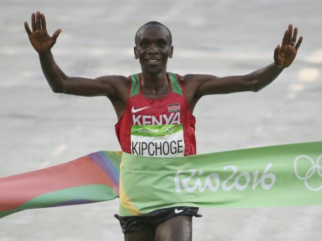 Eliud Kipchoge crosses the finish line. Photo: Reuters