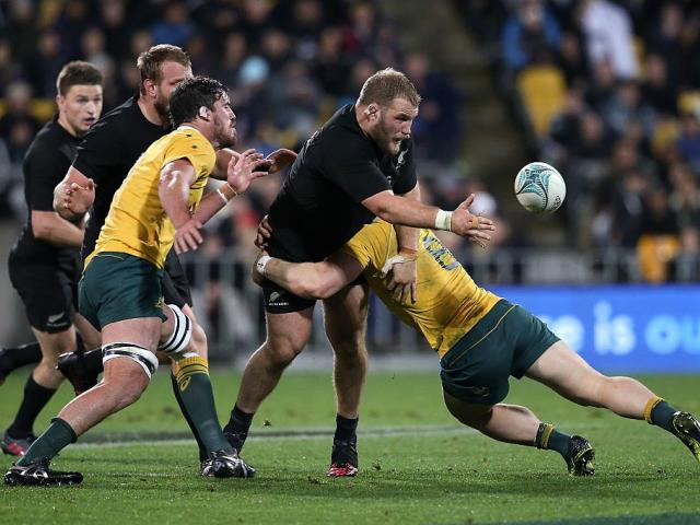 Owen Franks offloads the ball during the All Blacks' game against Australia. Photo: Getty Images
