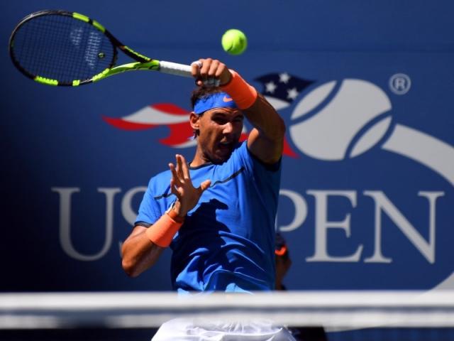 Rafael Nadal returns the ball in his first round US Open match. Photo: Reuters