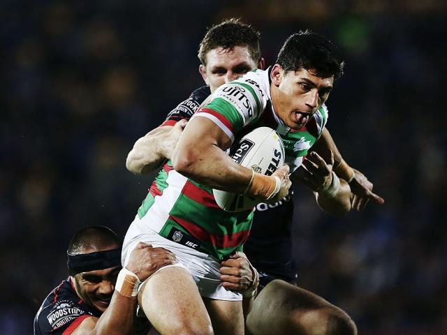 Kyle Turner carries the ball for Souths as Ryan Hoffman tries to tackle him. Photo: Getty Images
