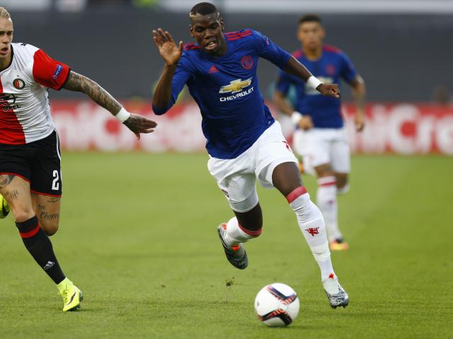 Feyenoord's Rick Karsdorp in action with Manchester United's Paul Pogba. Photo: Reuters