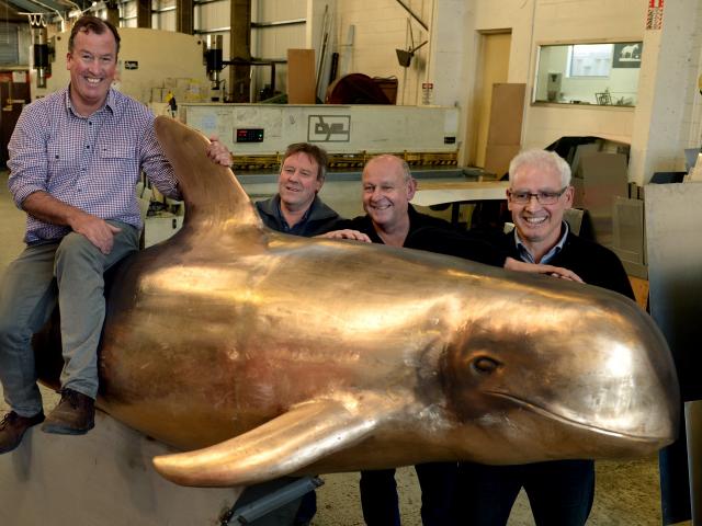 Dunedin sculptor Bryn Jones displays his latest creation — a statue of Pelorus Jack — with those...