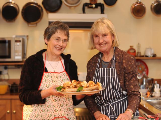 Helen Leach (left) and Mary Browne with their home made cheese rolls. Photo: ODT files
