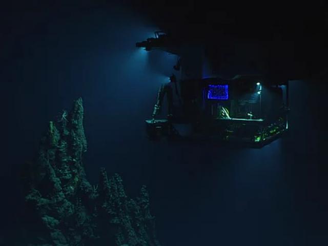 The remotely operated vehicle Deep Discoverer surveying a 14m hydrothermal chimney. Photograph:...