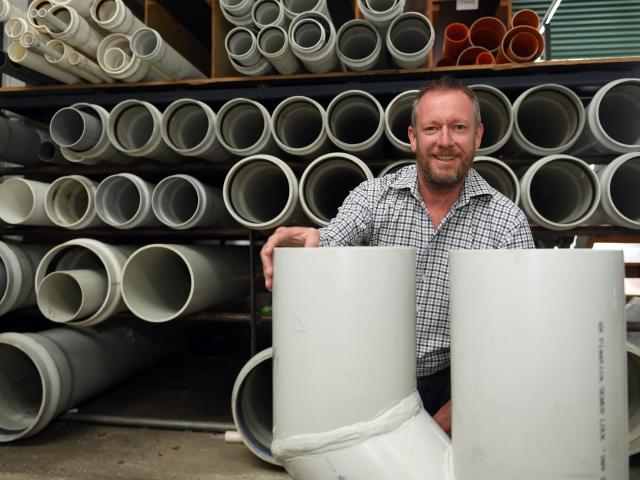 Progressive Plastics managing director Neville Chisholm shows off a stormwater junction...