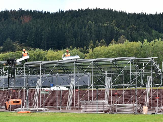 Scaffold goes up at the University Oval yesterday in preparation for the first test against South...