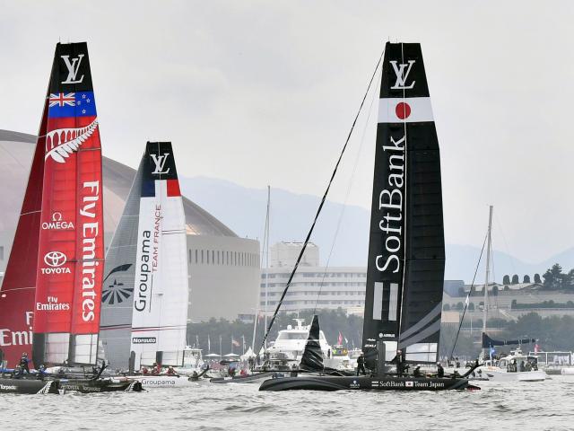 Team New Zealand, Team France and Team Japan in action. Photo: Reuters