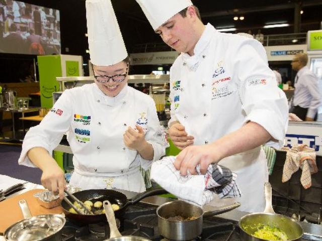 Otago Polytechnic Central Campus chefs Freda Zhang (left) and Sam Farr cook their way to a silver...