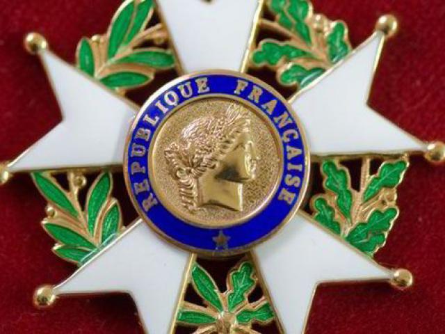 A close-up of the French Legion of Honour medal.