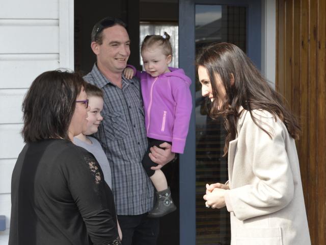 Labour leader Jacinda Ardern visits (from left) Tracy Douglas and Brooklyn (9), Loncey and Brylee...