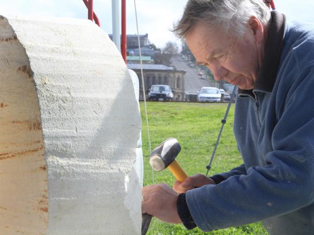 Dunedin sculptor Craig McLanachan works on a piece at the Oamaru Stone Symposium at Friendly Bay...