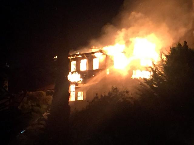 Fire rips through the abandoned Glamis Hospital in Mornington  yesterday morning. Photo: Roz Turner