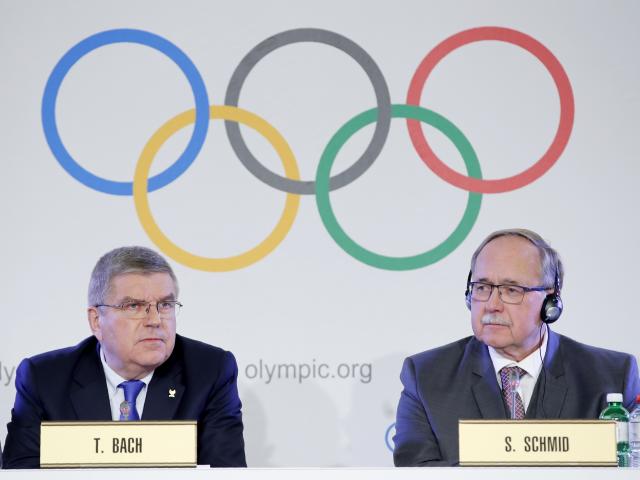 Samuel Schmid, Chair of the IOC Disciplinary Commission, and Thomas Bach, President of the...