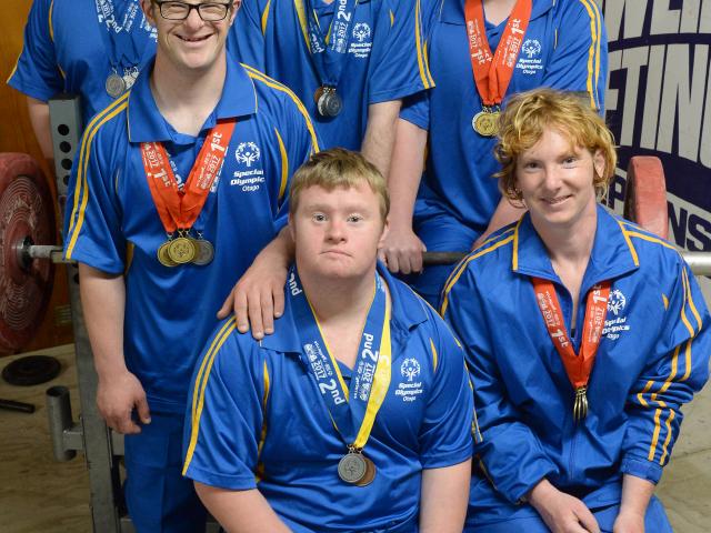 Seated at front: Ryan Doherty (21) and Kara Brash (31). Middle row: Ryan Stewart (32). Back row...