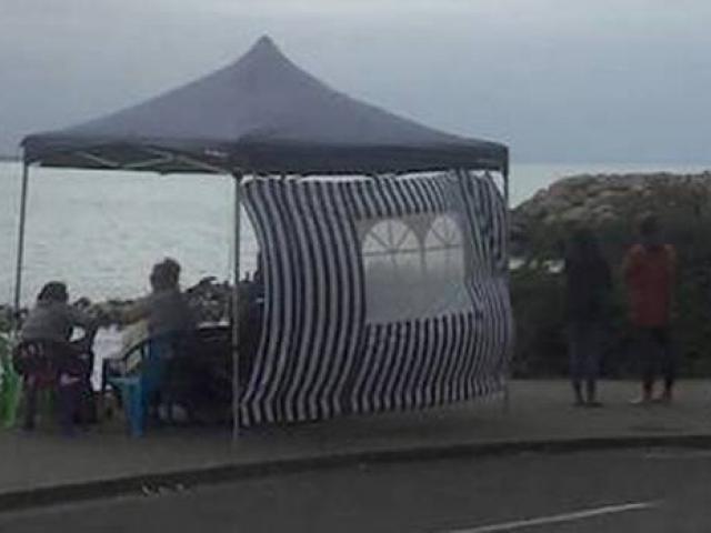 Members of Jack Sutton's family hold a vigil at Scarborough Beach. Photo: Givealittle