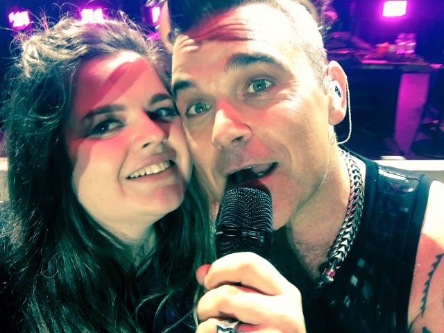 Dunedin Robbie Williams fan Manda Hall (26) on stage with her idol.