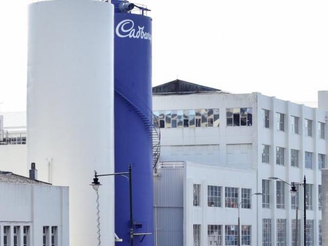 Production workers at Cadbury will clock off for the final time at midday today, on the eve of...
