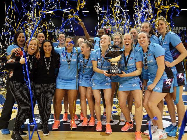 The Southern Steel players and staff celebrate with the ANZ Premiership trophy  after beating the...