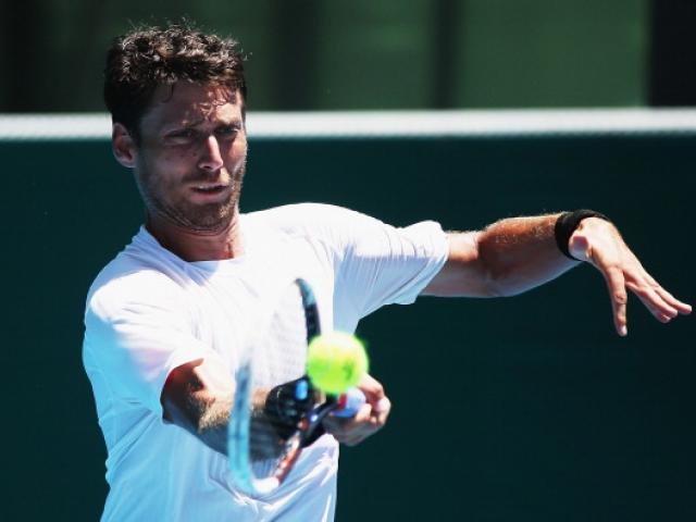 Artem Sitak of New Zealand plays a forehand during his qualifying match against Donald Young of...